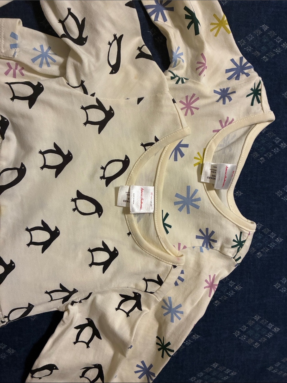 Hanna Andersson Cream Long-Sleeve Tee with Black Penguin and Multi Star Prints